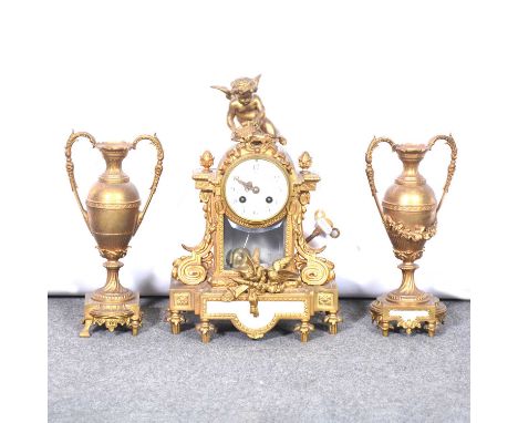 French gilt metal clock garniture, the clock with cherub above a circular white enamel dial painted with floral swags, Arabic