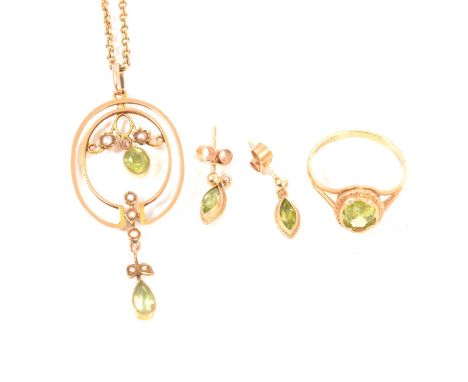 An Edwardian peridot and seed pearl pendant, the 50mm pendant with oval and pear mixed cut peridots bezel set with a bead bor
