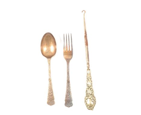 A silver Christening spoon and fork, William Gallimore &amp; Sons, Sheffield 1903, floral decoration, 2.4oz; and a button hoo