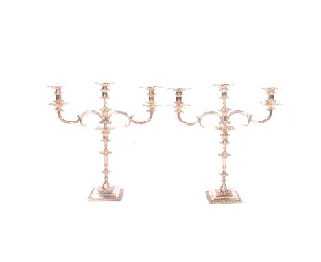 Pair of Edwardian silver three light candelabra, Charles Stuart Harris, London 1904, Georgian style with wrythen fluting, scr