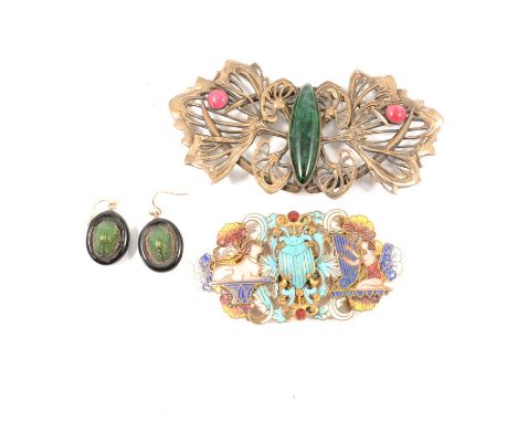 An Art Nouveau converted buckle with large green paste marquise shape cabochon to centre and red circular cabochon to each si