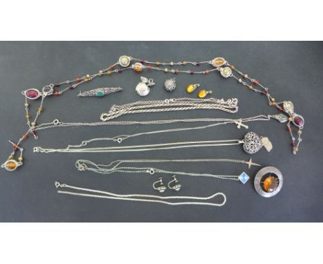 A selection of silver jewellery including a yellow stone Celtic brooch, necklaces, earrings, lockets etc.