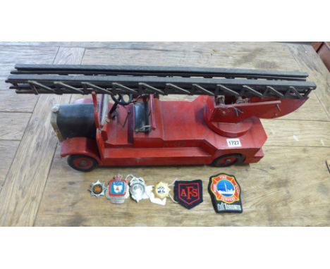 A wooden Fire Engine model circa 1940 Fireman's badges