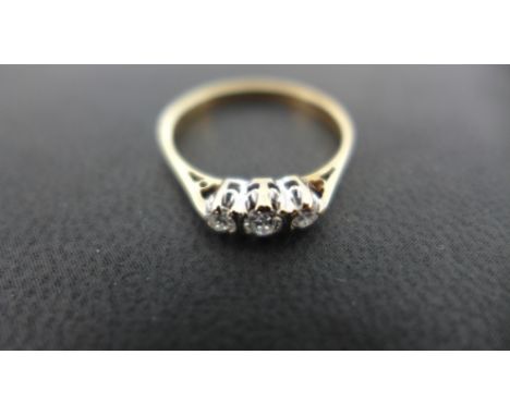 A 9ct yellow gold three stone diamond ring - Size K - Weight approx. 1grm Condition report: Stones bright clean condition 