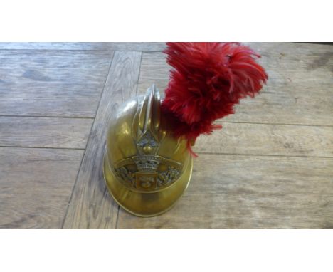A French Fireman's brass helmet bearing the crest - Sapeurs Pompres Les Essarts