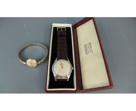 A Gents Garrard Automatic stainless steel wristwatch - not working but clean and a Ladies 9ct gold Garrard watch, manual wind