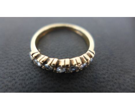 A 9ct yellow gold ring set with seven small diamonds to shoulder - size K - Weight approx 2 gms Condition report: Clean and c