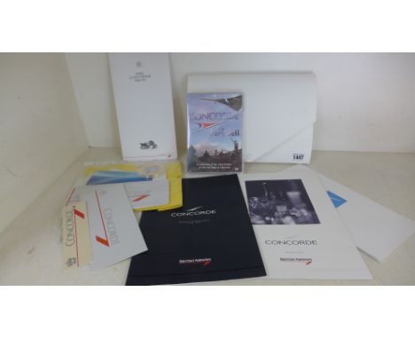 A collection on Concorde memorabilia including a D.V.D of Concorde's last flights, ticket stubs from 1992, a Concorde menu, a