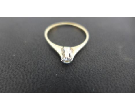 A 9ct yellow gold solitaire diamond ring - size K - Weight approx. 1 grm Condition report: Stone bright, clean condition 