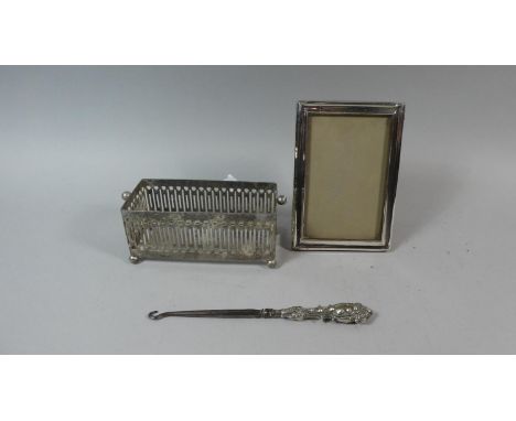 A Silver Mounted Frame, Silver Mounted Button Hook and Plated Stand 