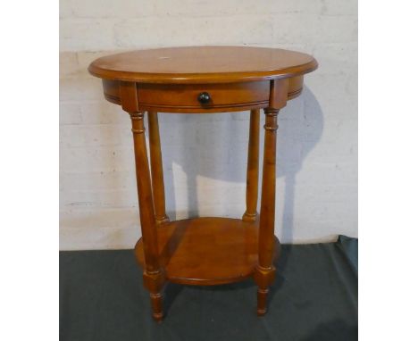 A Modern Oval Topped Occasional Table with Stretcher Shelf and Top Drawer 