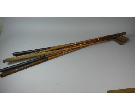 A Collection of Seven Vintage Wooden Shafted Golfing Irons 