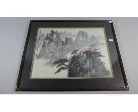 A Framed Oriental Print Depicting House in Mountains 