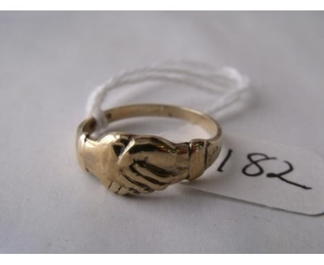 A clasp hands ring mounted in 9ct     