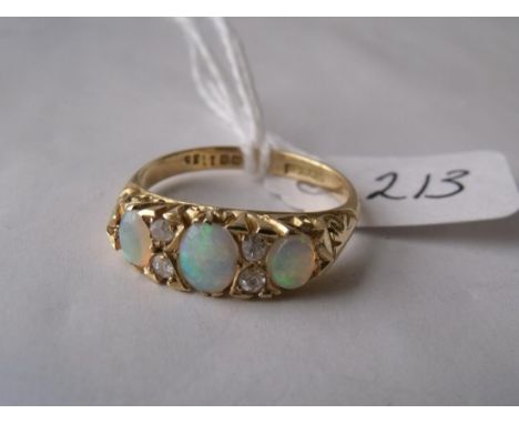 An 18ct gold opal and diamond seven stone ring  approx size 'Q'       