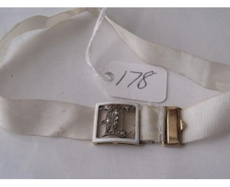 A gold mounted enamel & diamond  garter clasp        