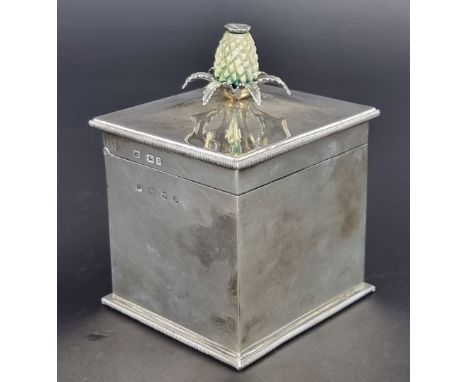 A silver tea caddy, having ivory thistle finial by&nbsp;D &amp; J Wellby Ltd, London 1939, 12cm high; together with a silver 