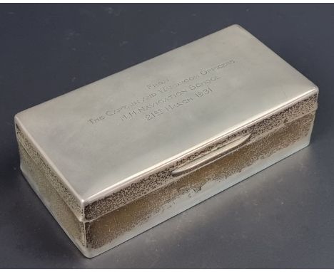 A silver cigarette case, by&nbsp;Goldsmiths &amp; Silversmiths Co Ltd, London 1930, 18cm wide, inscribed to lid.