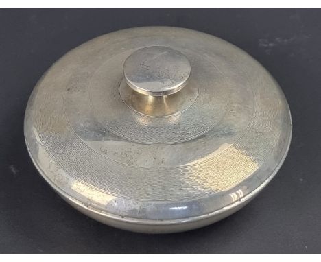 An engine turned silver and Bakelite powder pot, by J C Ltd, Birmingham 1935, 10.5cm diameter.