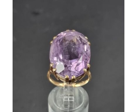 A yellow metal amethyst set cocktail ring, stamped 9ct, size P-P 1/2.