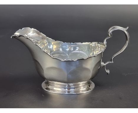 A silver cream jug, by&nbsp;Mappin &amp; Webb Ltd, Birmingham 1929, height to handle 8.5cm, 141g.