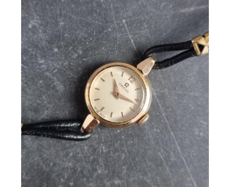 An Omega gold plated manual wind ladies wristwatch, 19mm, Ref. 2795-6, Cal. 244, on original integrated leather strap.