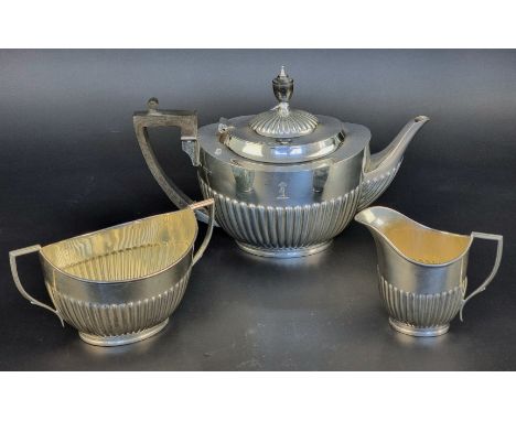 A silver three piece teaset, by&nbsp;William Hutton &amp; Sons Ltd, London 1909/10, teapot height 19cm, gross weight 1,050g.