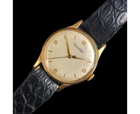 A late 1950s IWC 9ct gold manual wind wristwatch, 33mm, Ref. 917995, Case Ref. 13322, Serial No. 1449920, on contemporary bla