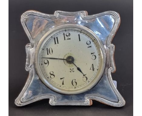 An Edwardian silver mounted easel back timepiece, by Charles S Green &amp; Co Ltd, Birmingham 1906, 11.5cm high.