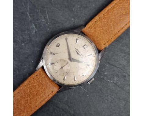 A 1959 Longines stainless steel manual wind wristwatch, 34mm, having subsidiary seconds dial, Ref. 7033-5 1028, Serial No. 11