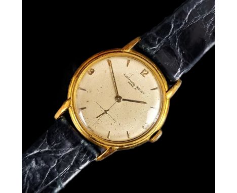 A 1950s Audemars Piguet 18ct gold manual wind Calatrava style wristwatch, 33mm, the dial having crosshair subsidiary seconds 