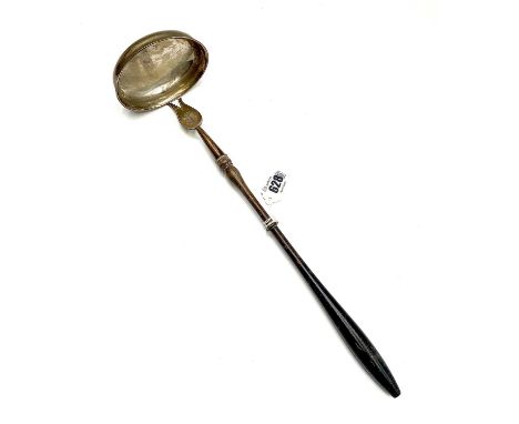 An unusal provincial or colonial punch ladle, with turned wooden handle and large oval bowl.Indistinctly marked and engraved 