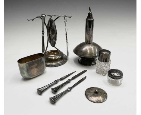 A George V silver manicure stand by Sanders &amp; Mackenzie Birmingham 1927 holding four manicure tools and a nail polisher (