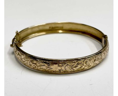 An Edwardian 9ct gold hinged engraved bangle Birmingham 1905 7.5gm Internal size 53.7x54.7mmCondition report: Hinge and clasp