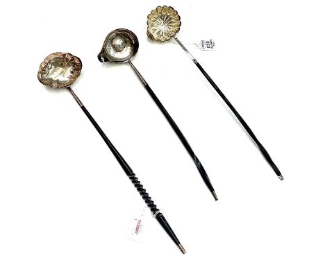 Two Georgian silver punch ladles, both with whale bone handles, one with fluted bowl and pouring lip. The other a simple roun