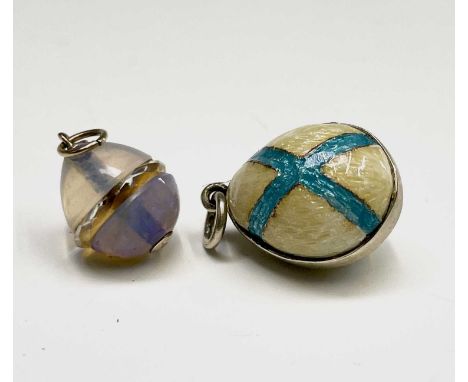 A gold-mounted miniature opal and crystal egg 12mm excluding mount and an enamelled miniature egg 16.5mm excluding mounts