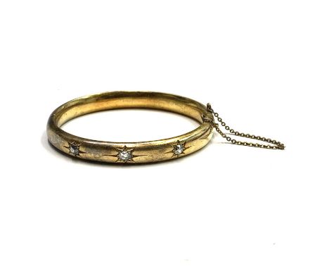A Victorian high-purity matt gold hinged bangle with three gypsy set diamonds Internal size 48x54mm 15.7gmCondition report: U