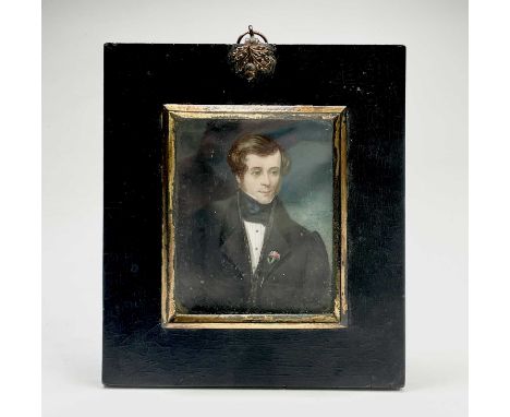 Portrait miniatureAn early 19th century portrait of a handsome young gentleman in black frock coat and blue silk cravat.Finel