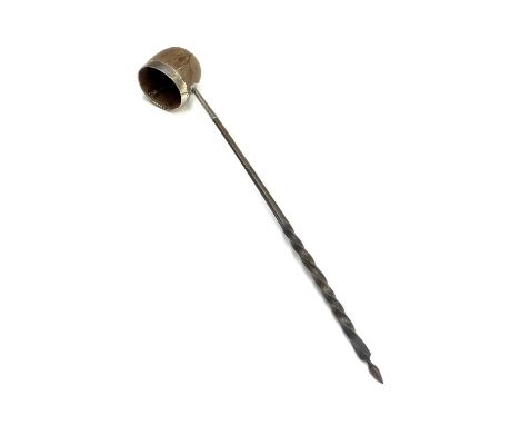 A Georgian punch ladle with spiral whale bone handle, the bowl a silver mounted wooden nut.