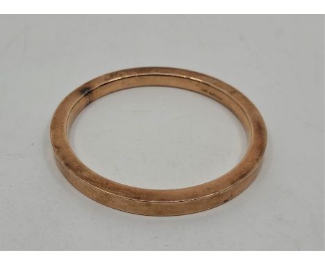 A 9ct. rose gold bangle, Birmingham 1924, external diameter 8.3cm. (17.9g) 