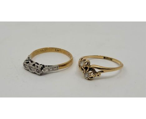 An 18ct. yellow gold and two stone diamond cross-over ring, size; UK L, together with an 18ct. yellow gold, platinum diamond 