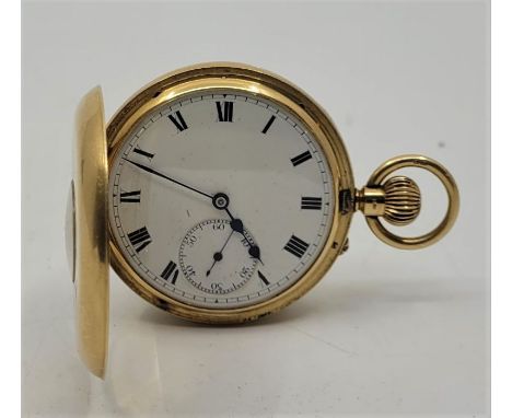 An 18ct. gold half hunter pocket watch, crown wind, having white enamel Roman numeral dial and subsidiary Arabic numeral seco