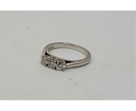 An 18ct. white gold diamond three stone ring, set three round brilliant cut diamonds (estimated diamond weight approx. 0.45 c