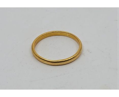 A precious yellow metal wedding band, marks for London 1933, (yellow metal assessed as gold of at least 18ct.).&nbsp; (3.4g).