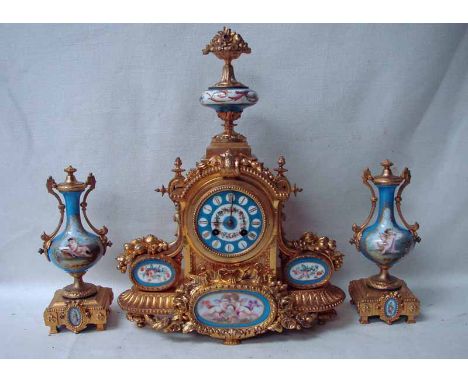 A French gilt metal and porcelain clock garniture by Japy Freres & Cie, fruit and blossom filled urn finial hand painted, sev