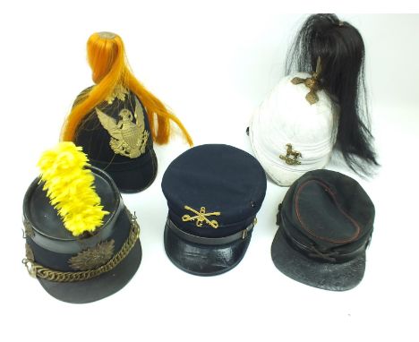 An American 19th Century peaked cap, the inside stamped NY Vols, together with another later to a cavalry regiment, a further