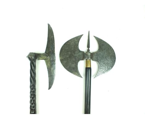 Two Indian axes, the first with double crescent head etched with foliage, crowns and tigers, spike terminal, carved hardwood 