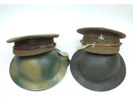 An early 20th Century Khaki peaked cap to the Notts and Derby Regiment, the green khaki body with two large ventilation holes