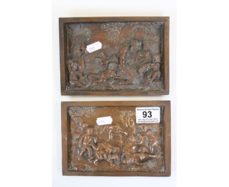 Pair of heavily embossed plaques, one in Copper the other with Copper finish, depicting playing Cherubs and Pan in Woodland s