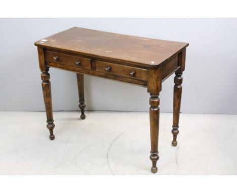 Mid 19th century Mahogany Side Table with Two Drawers, Turned Wooden Handles and raised on turned tapering legs, 98cms long x